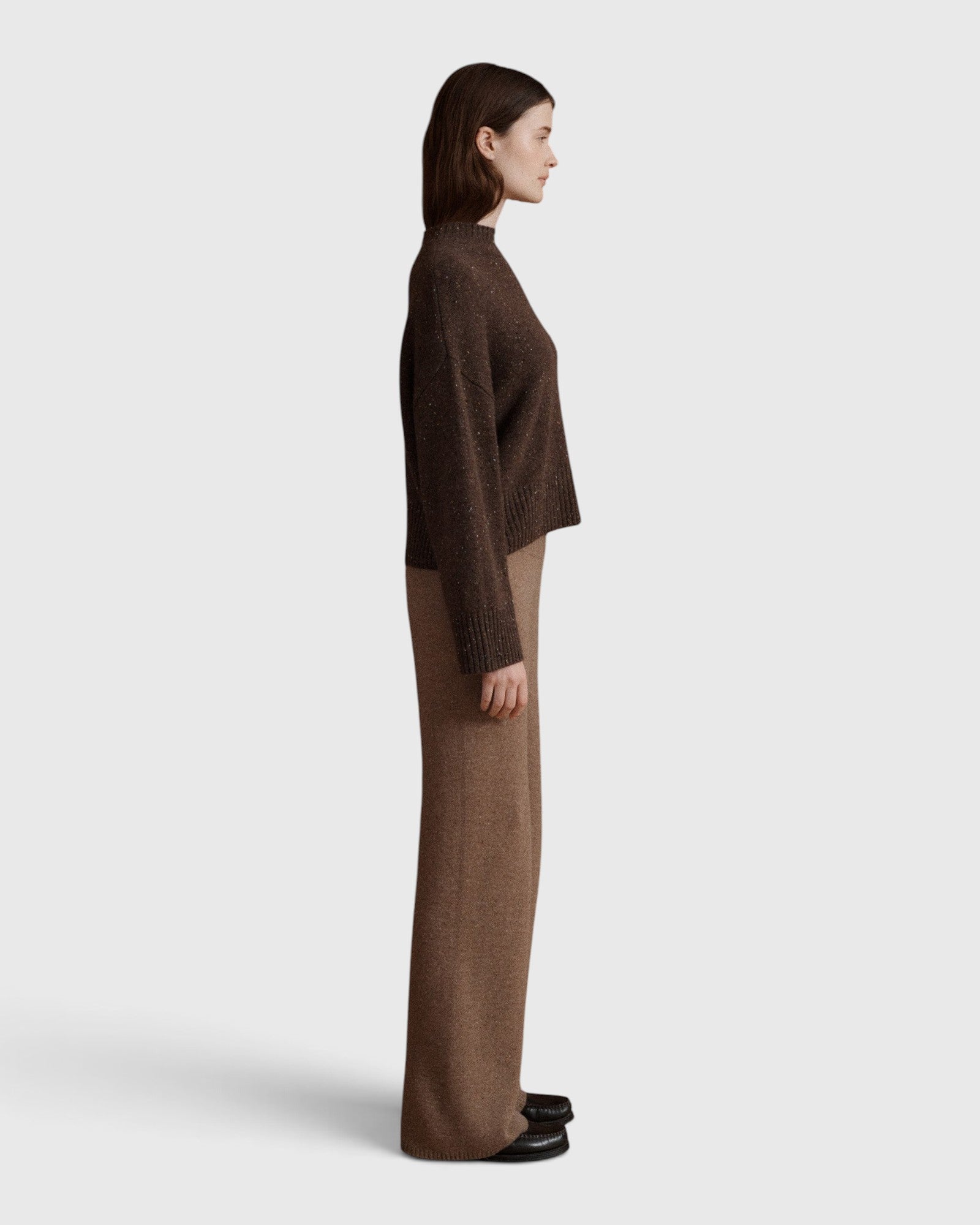 JONES + CO Bettina cashmere sweater in oak brown with mock neck, balloon sleeves, and dropped shoulders, side view.