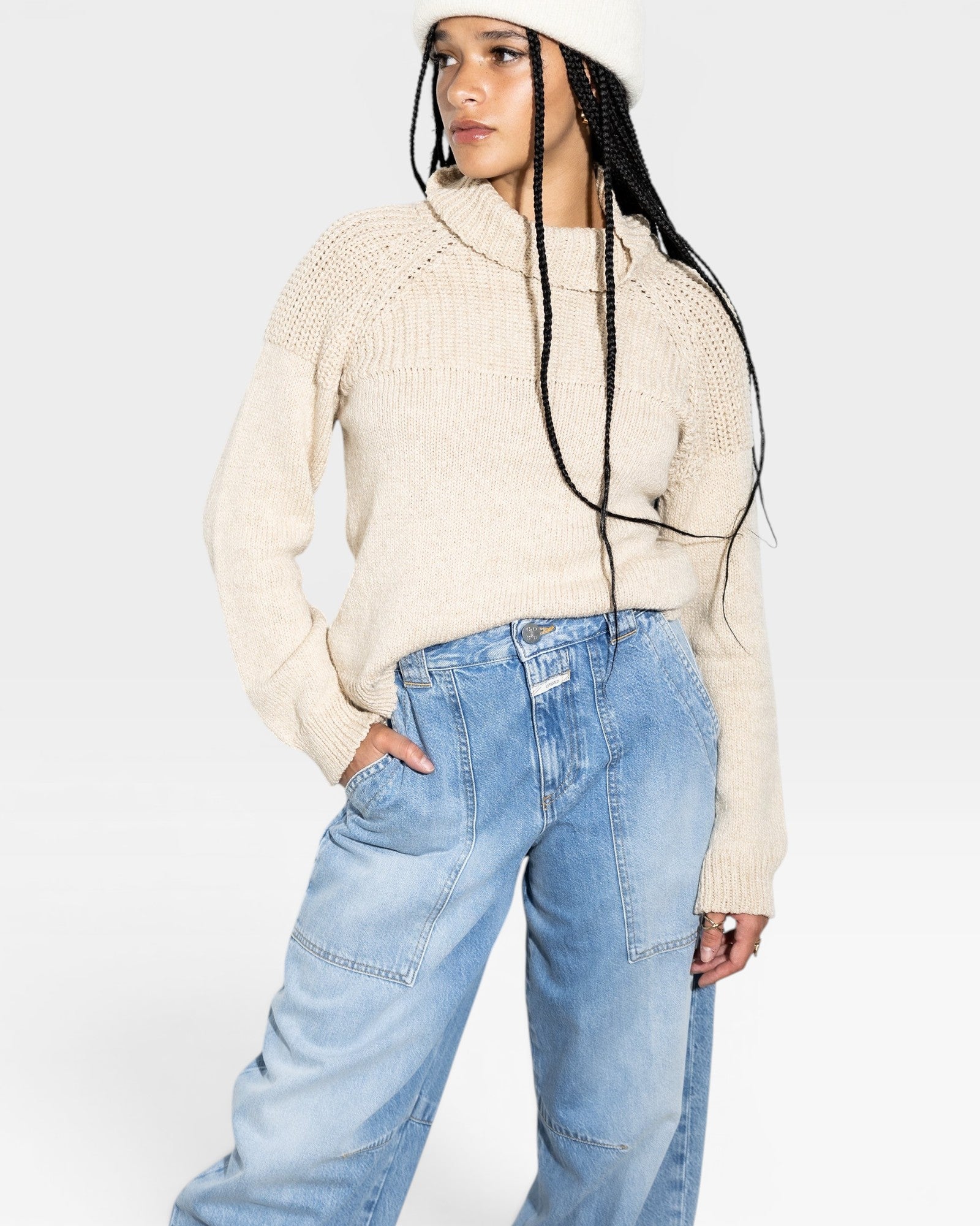 JONES + CO oat turtleneck sweater in a light-weight alpaca and cotton knit with chunky shoulder rib details and ribbed cuffs.