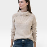 JONES + CO oat-colored turtleneck sweater made from baby alpaca and cotton yarn with chunky rib details and ribbed cuffs.