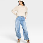 JONES + CO oat-colored turtleneck sweater with chunky rib details on the shoulders and cuffs, made from baby alpaca and cotton yarn.
