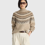 JONES + CO oatmeal Fair Isle mock neck sweater with ribbed trim worn by a model in sunglasses and cream trousers.
