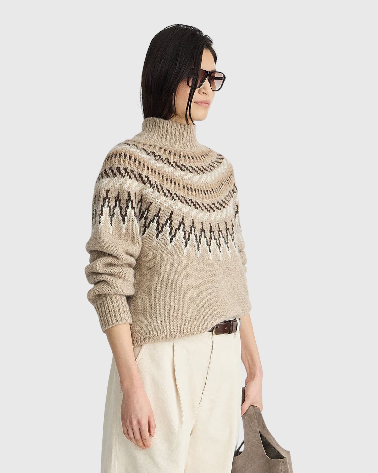 JONES + CO oatmeal mock neck sweater featuring a traditional fair isle knit pattern and ribbed trim details.
