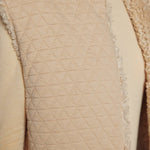 JONES + CO oatmeal reversible vest featuring a quilted texture on one side and plush faux fur trim detail.