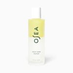 JONES + CO Ocean Wave Cleanser bi-phase makeup remover and cleansing oil in a clear bottle with a white cap.