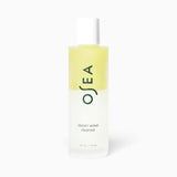 JONES + CO Ocean Wave Cleanser bi-phase makeup remover and cleansing oil in a clear bottle with a white cap.