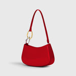 JONES + CO Ollie Bag in polished cherry-red leather with a crescent shape, shoulder strap, and gold-tone hardware.