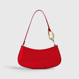 JONES + CO Ollie Bag in polished cherry-red leather with a crescent shape and gold and silver hardware strap detail.