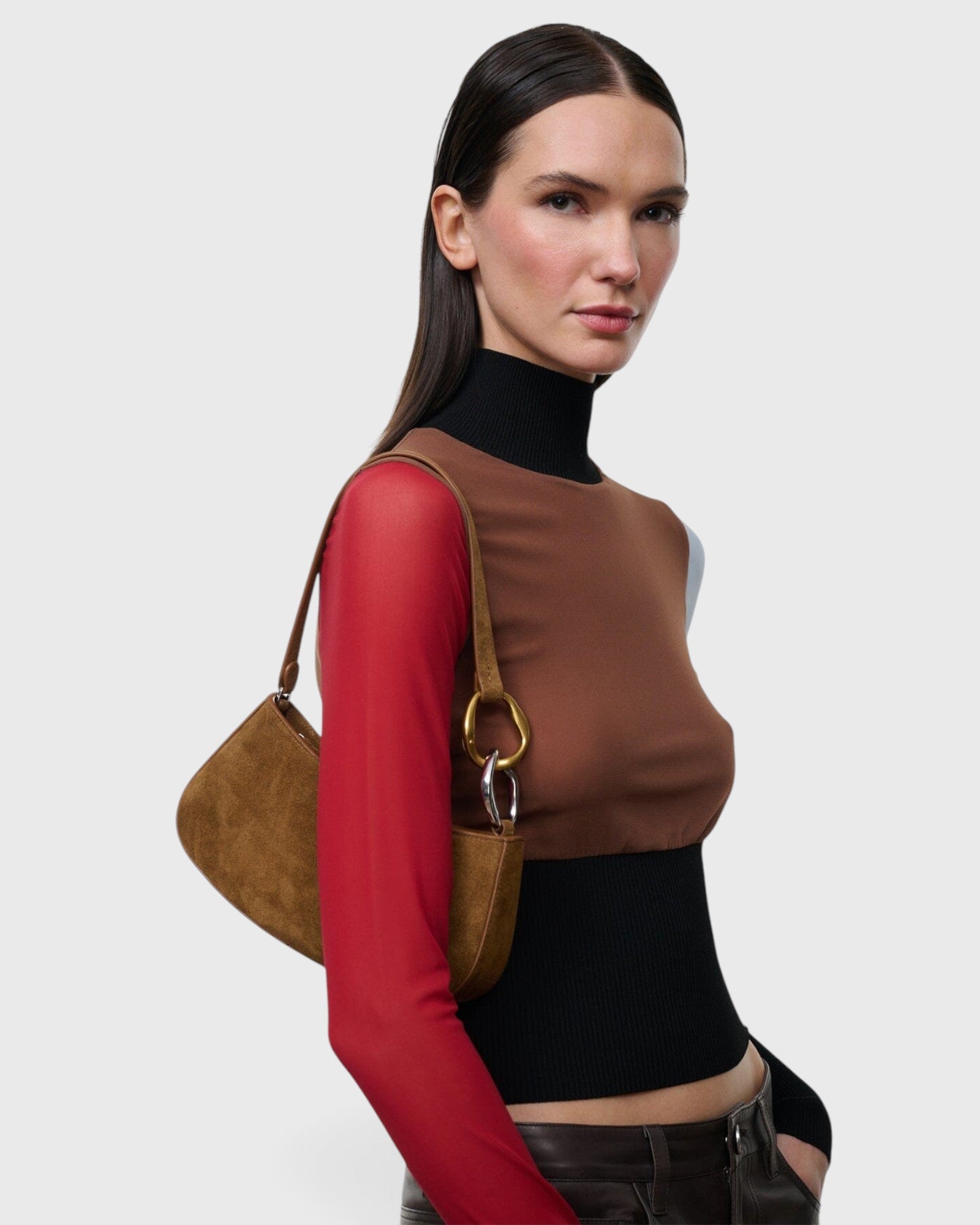 JONES + CO Ollie Bag in cigar brown suede with a crescent silhouette and two-tone gold and silver link strap.