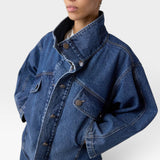 JONES + CO dark denim oversized jacket with stand collar, asymmetric snap closure, and flap pockets.