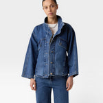 JONES + CO dark wash denim oversized jacket with stand collar, asymmetric snap closure, and flap pockets.
