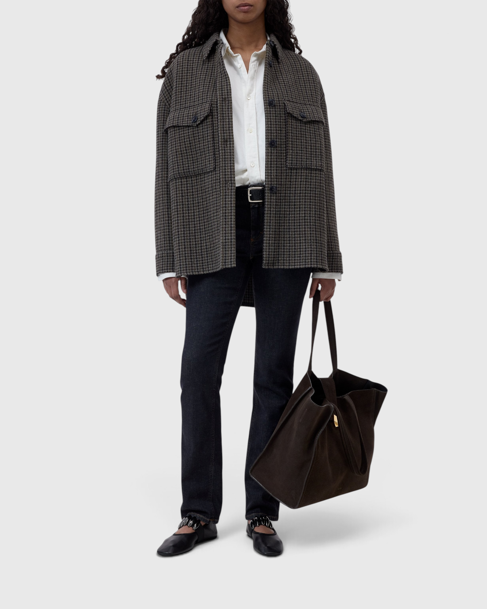 JONES + CO oversized juniper green wool-blend shacket with a checked pattern and diagonal breast pockets on a model.