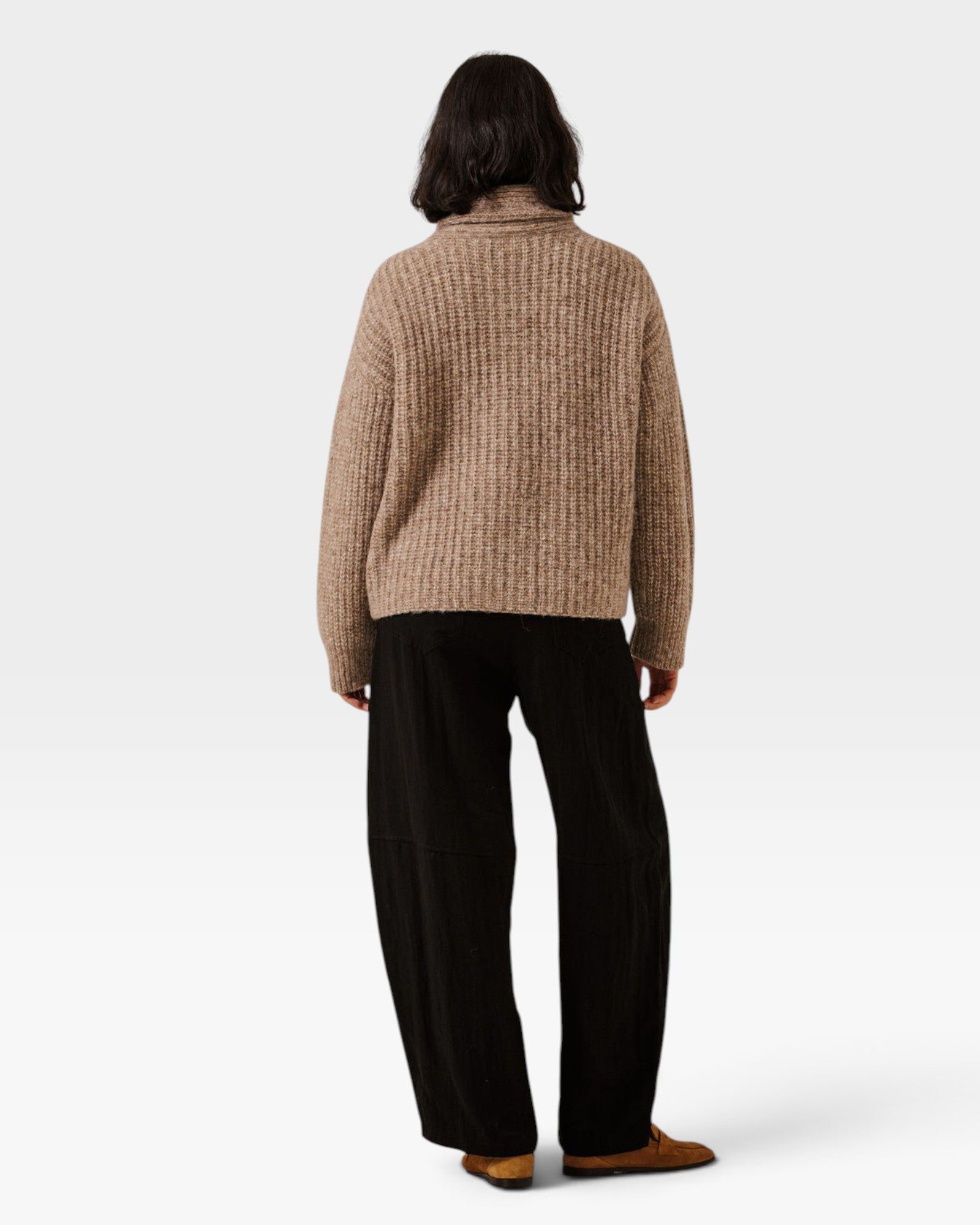 Back view of a model wearing a JONES + CO dark fawn oversized shawl cardigan in an alpaca and Pima cotton blend.