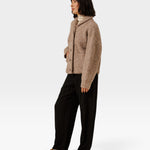 JONES + CO oversized shawl-collar cardigan in dark fawn alpaca cotton blend worn with black trousers and loafers.