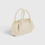 JONES + CO Oyster Mini Duffle in Angora pebble grained Italian leather with gold-tone hardware and top handles.