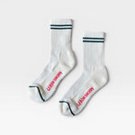 JONES + CO parchment boyfriend socks featuring green double stripes, breathable mesh, and red branding on the foot.
