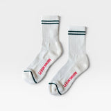 JONES + CO parchment boyfriend socks featuring green double stripes, breathable mesh, and red branding on the foot.