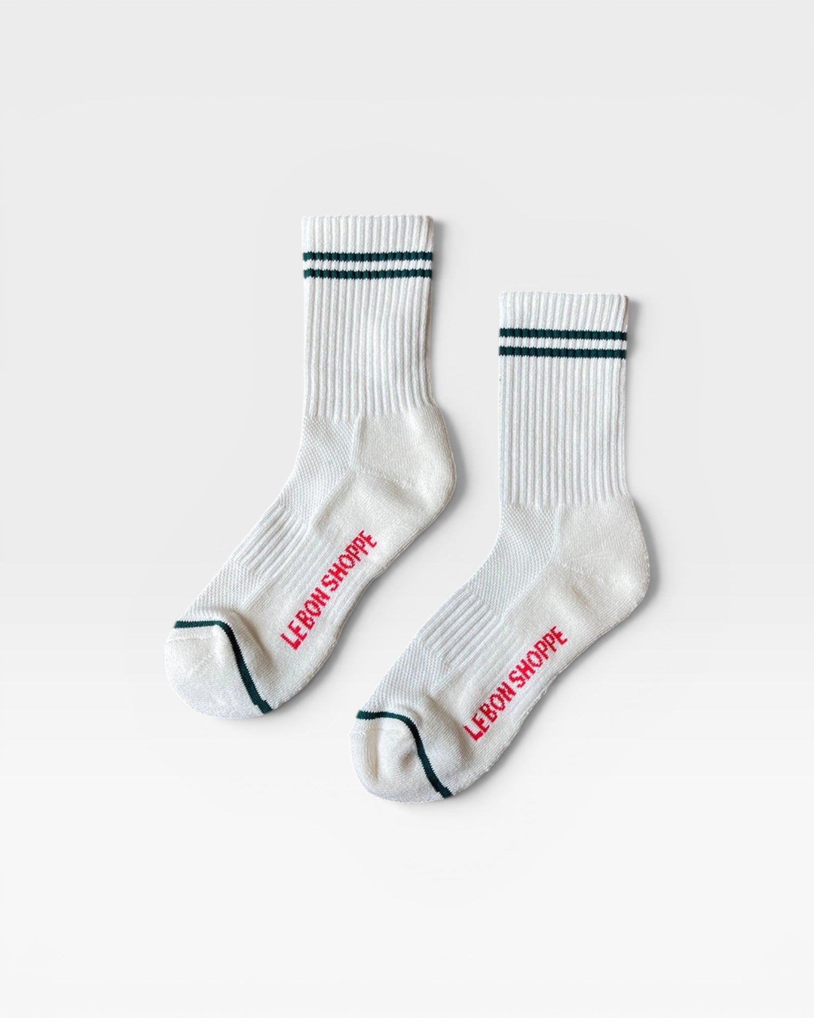 JONES + CO parchment boyfriend socks featuring green double stripes, breathable mesh, and red branding on the foot.