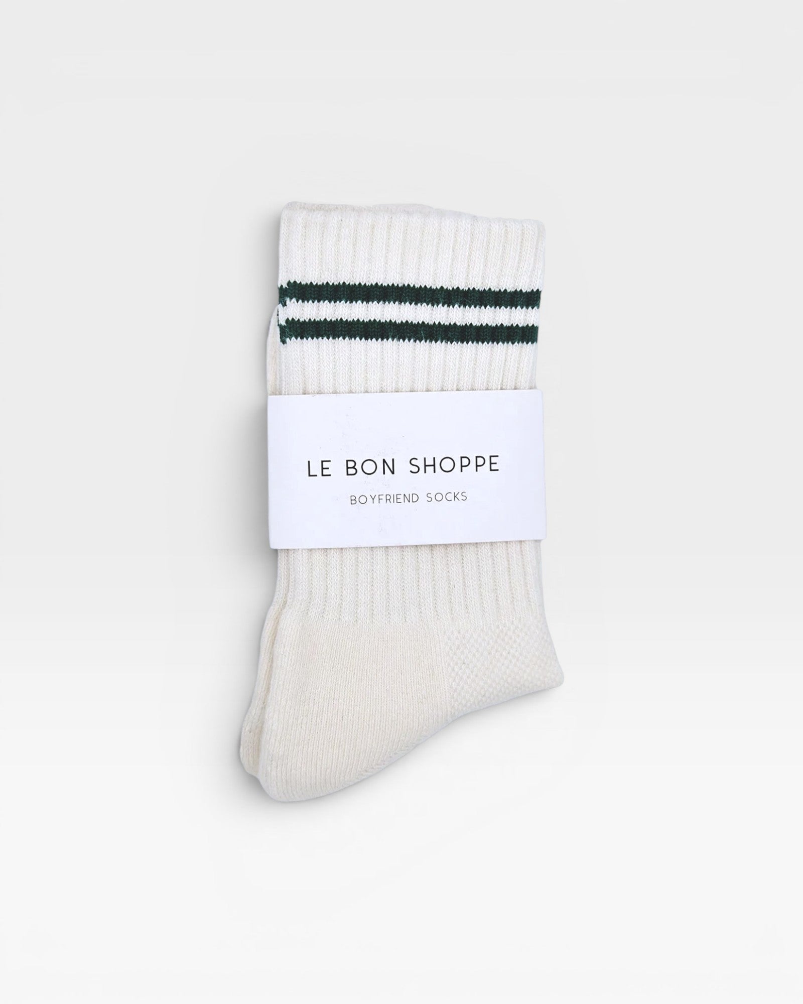 JONES + CO parchment boyfriend socks with green double stripes and ribbed texture in original packaging