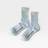 JONES + CO Boyfriend Socks in pastel sky blue with yellow double stripes, ribbed texture, and arch support.