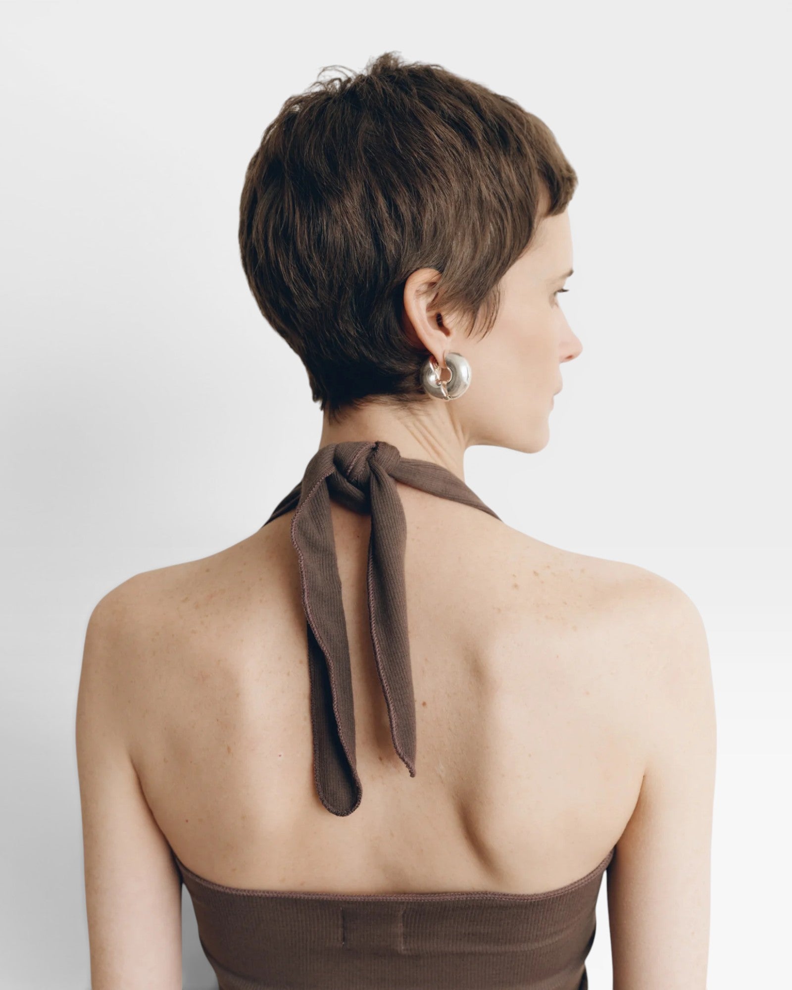 JONES + CO Pauline Halter Top in bark brown modal fabric with ribbed texture and contrasting trim.