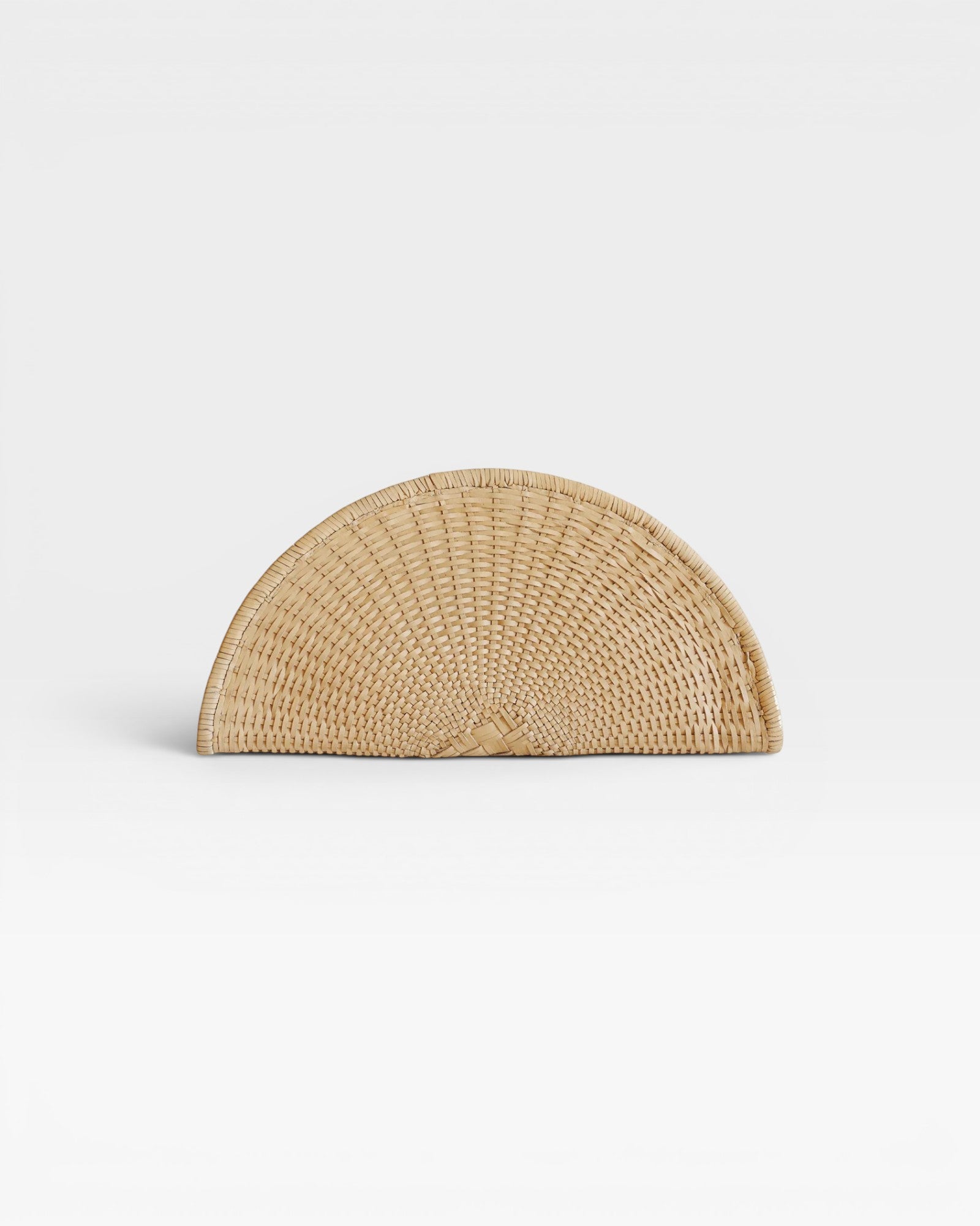 JONES + CO Perla Clutch in caramel, a half-moon shaped bag made from handwoven basketweave leather with a wrap-around zip.
