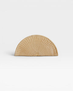 JONES + CO Perla Clutch in caramel, a half-moon shaped bag made from handwoven basketweave leather with a wrap-around zip.
