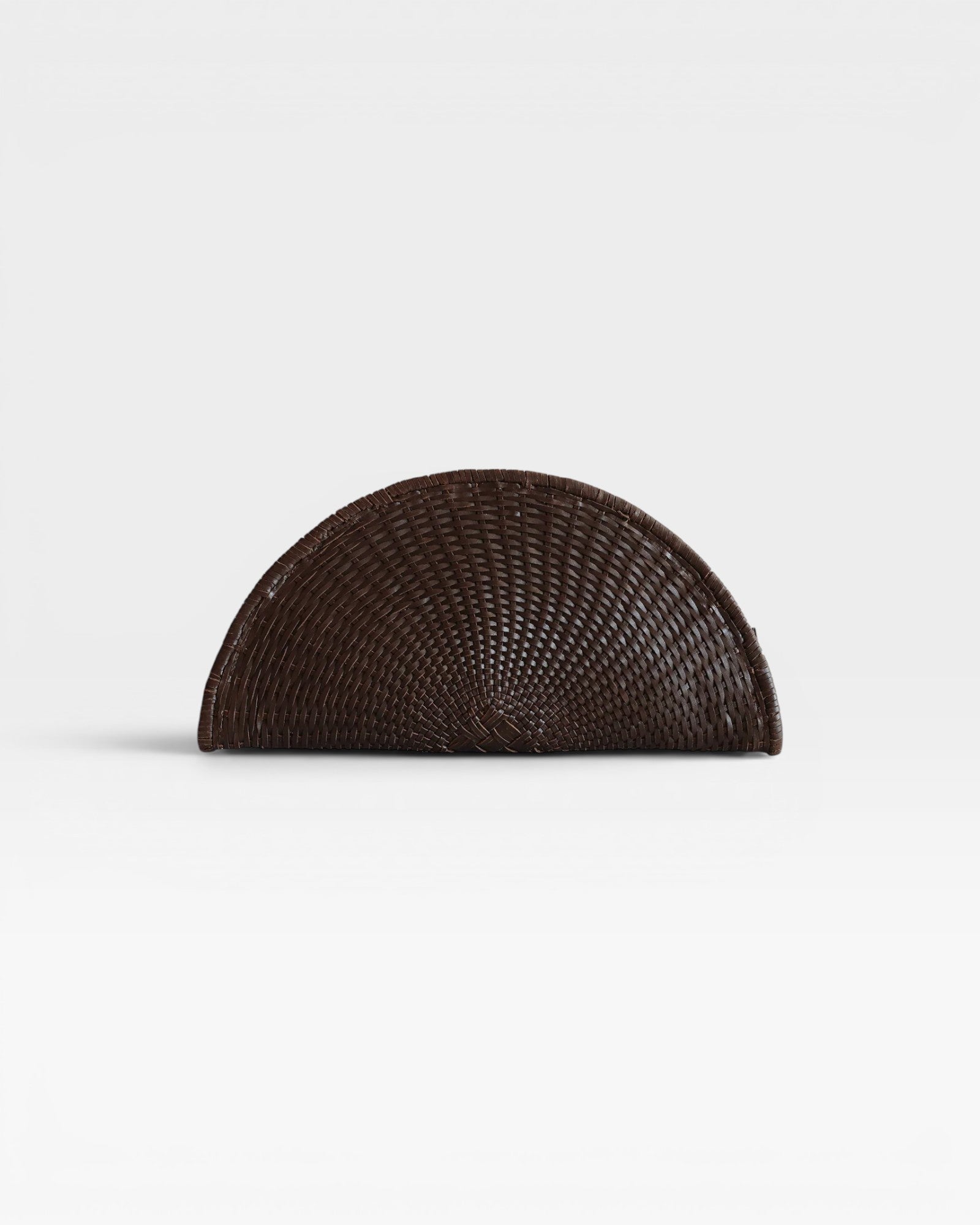 JONES + CO Perla Clutch in espresso brown basketweave leather, seashell-shaped with wrap-around zip.