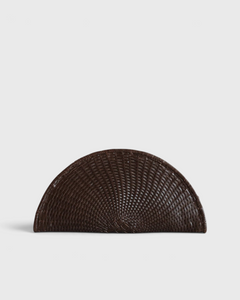 JONES + CO Perla Clutch in espresso brown basketweave leather, seashell-shaped with wrap-around zip.