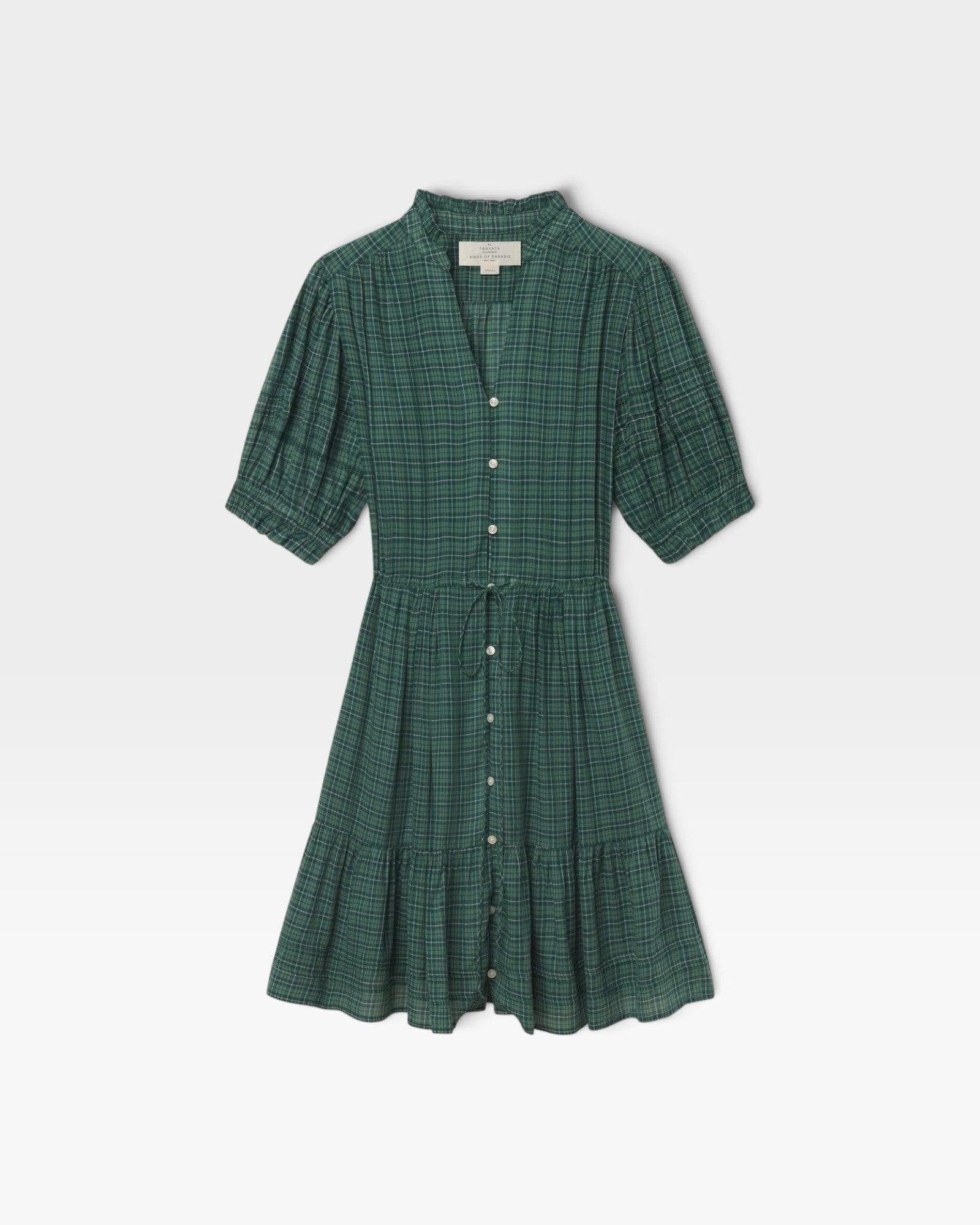JONES + CO Phoebe short shirtdress in green Muir tartan featuring a ruffled collar, pearl buttons, and pintuck details.