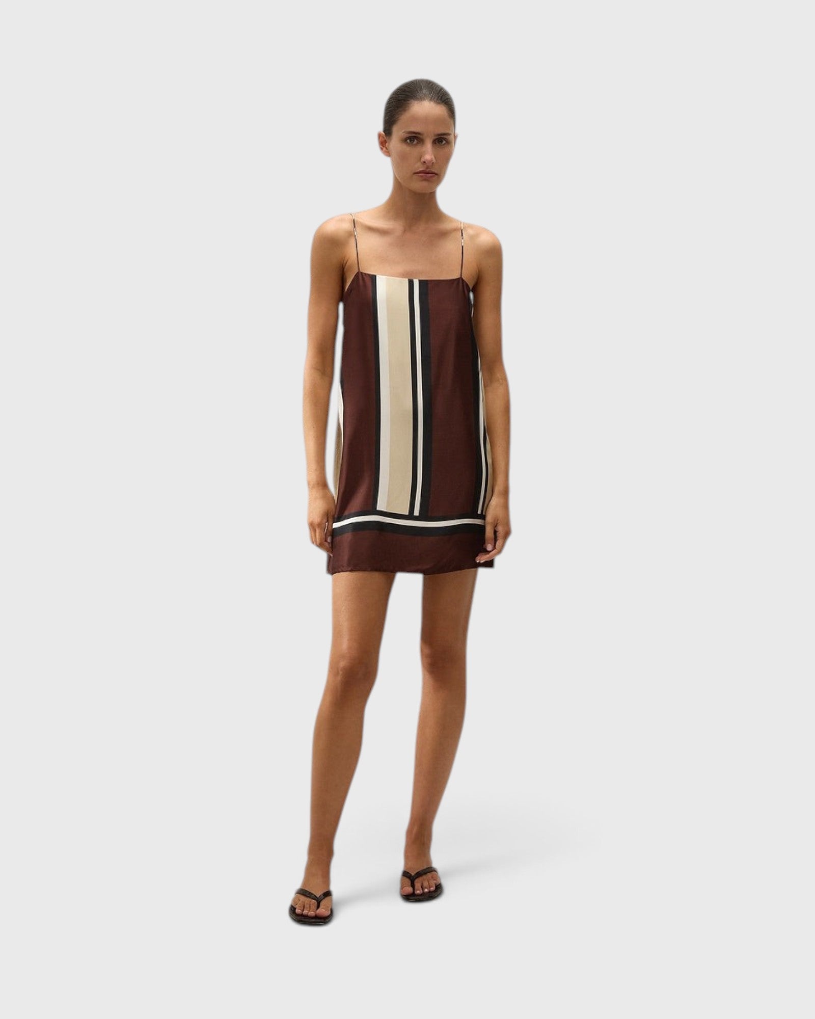 JONES + CO Phylis mini slip dress in brown and cream Sintra stripe viscose satin with thin adjustable straps.