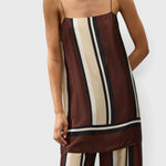JONES + CO Phylis mini slip dress in shiny viscose satin with brown, cream, and black Sintra stripe pattern.