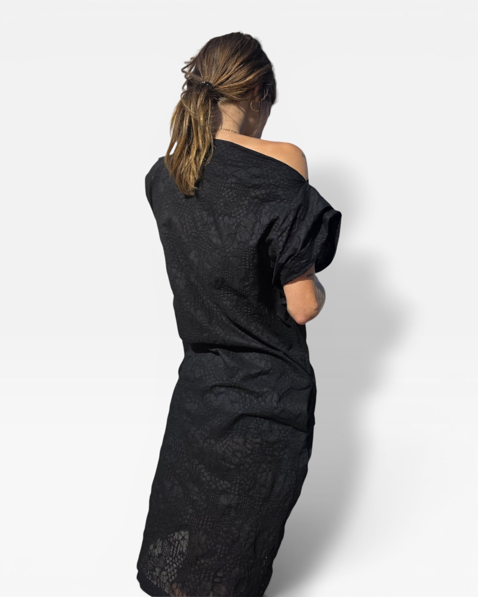 JONES + CO Pinch Shift black dress with embossed floral seersucker texture and off-shoulder neckline