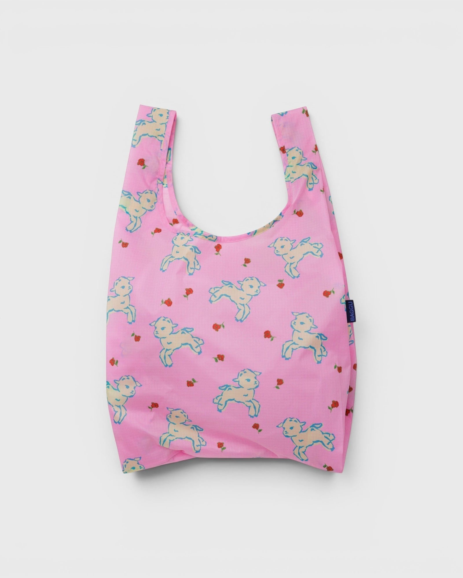 JONES + CO reusable grocery bag in pink ripstop nylon with a cute lamb and rose print pattern