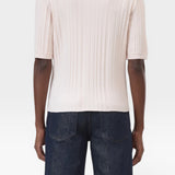 JONES + CO pale pink ribbed short sleeve polo shirt made from cotton yarn with cashmere and wool.