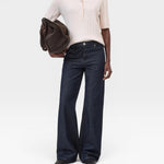 JONES + CO light pink ribbed short sleeve polo shirt made from cotton, cashmere, and wool blend.