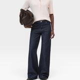 JONES + CO light pink ribbed short sleeve polo shirt made from cotton, cashmere, and wool blend.