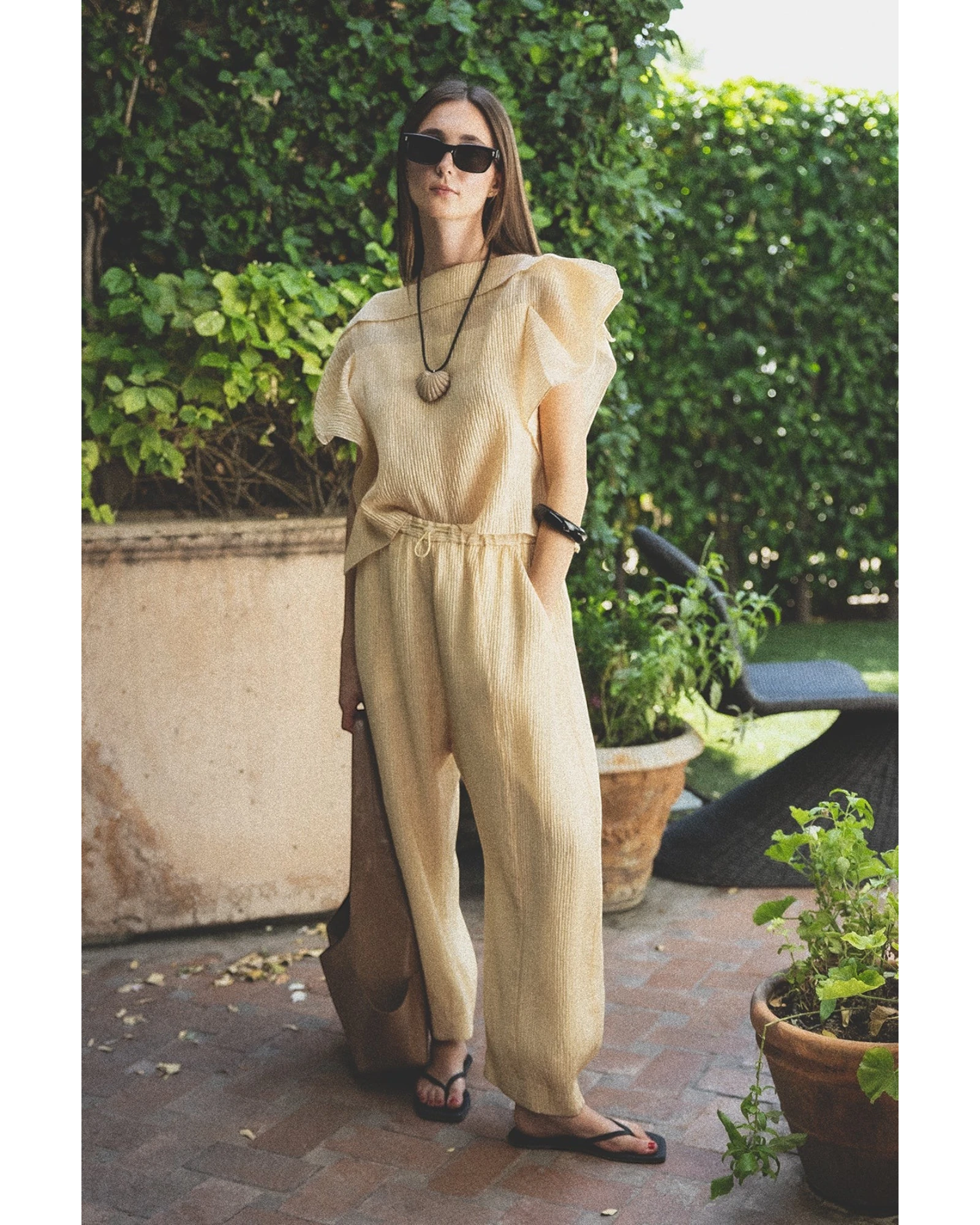 JONES + CO cream pleated linen blend top with flutter sleeves and wide-leg pants set.