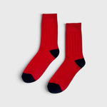 JONES + CO poppy red cashmere blend socks with wide ribbing and contrasting dark heel and toe detail.