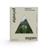 JONES + CO Private Aspen coffee table book featuring a triangular cutout showing a modern mountain home
