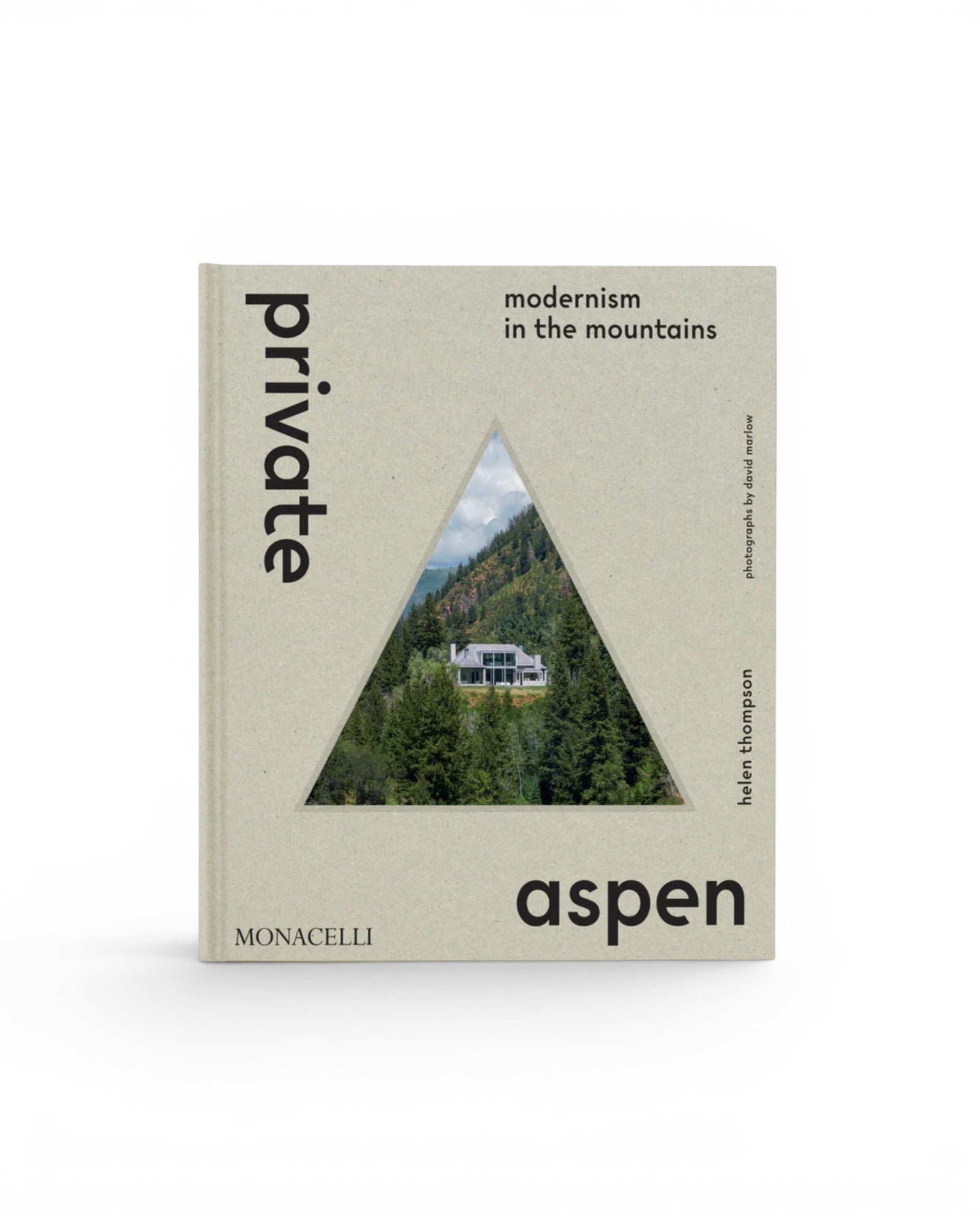 JONES + CO Private Aspen coffee table book featuring a triangular cutout showing a modern mountain home