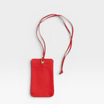 JONES + CO red pebble leather Paris Phone Purse crossbody bag with gold hardware and adjustable strap.