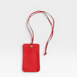 JONES + CO red pebble leather Paris Phone Purse crossbody bag with gold hardware and adjustable strap.