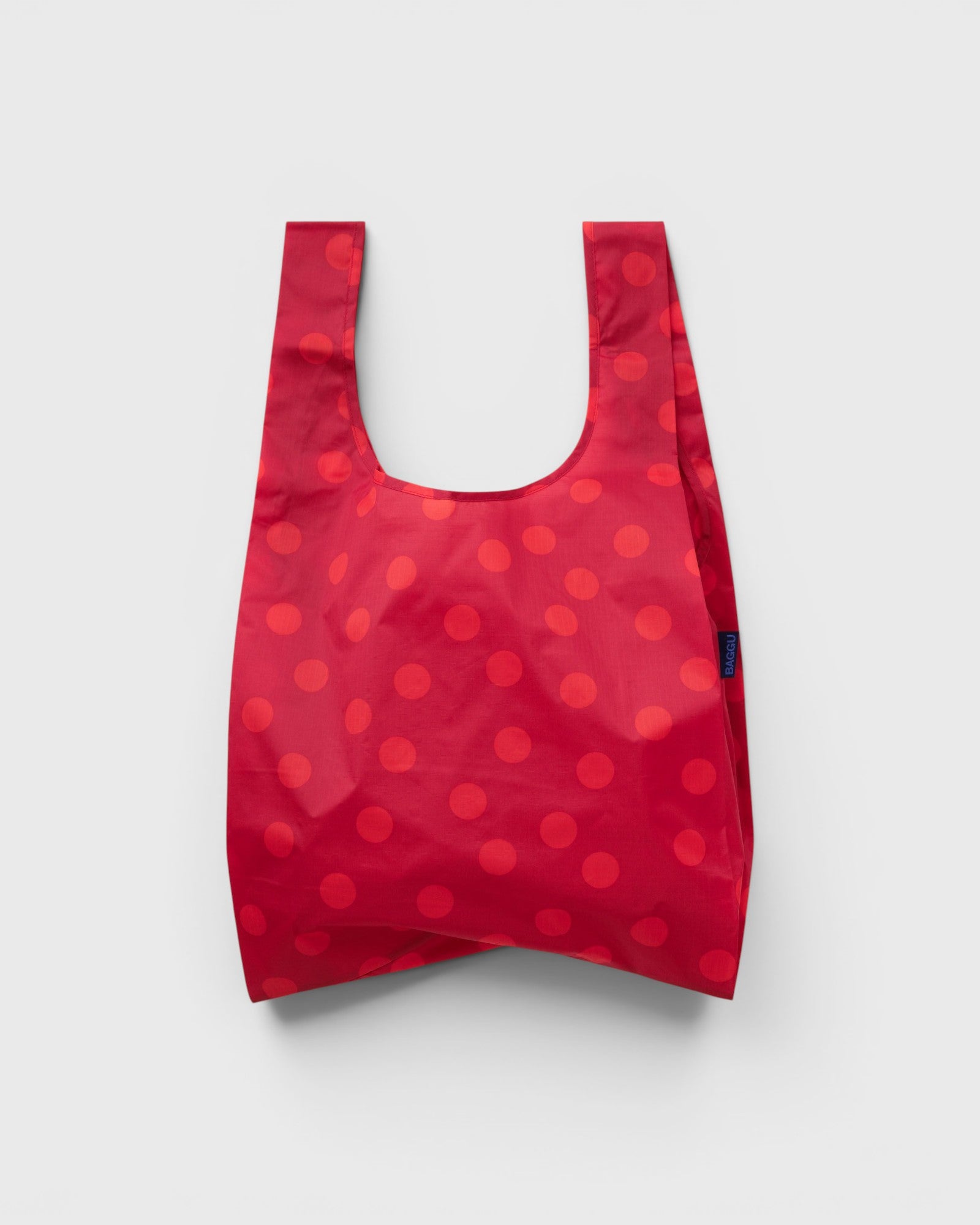 JONES + CO Standard Baggu reusable tote in red with a polka dot pattern made from lightweight ripstop nylon