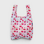 JONES + CO reusable grocery bag in pink nylon with a red cherry print pattern