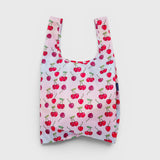JONES + CO reusable grocery bag in pink nylon with a red cherry print pattern