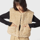 JONES + CO reversible short vest in oatmeal faux fur with a collarless design and front patch pockets