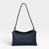 JONES + CO Roux Clutch: Fold-over flap bag in handwoven dark blue leather with a braided strap and magnetic closure.