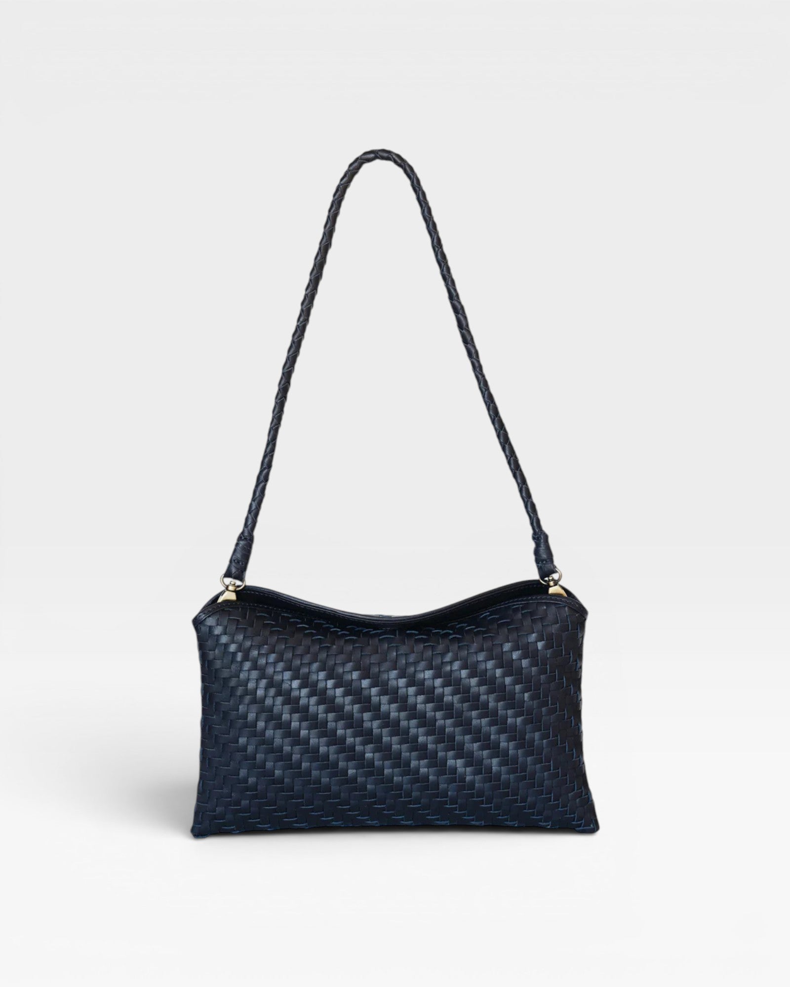 JONES + CO Roux Clutch: Fold-over flap bag in handwoven dark blue leather with a braided strap and magnetic closure.