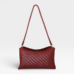 JONES + CO Roux fold-over clutch bag in woven red leather with a removable strap and magnetic closure.