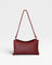 JONES + CO Roux fold-over clutch bag in woven red leather with a removable strap and magnetic closure.